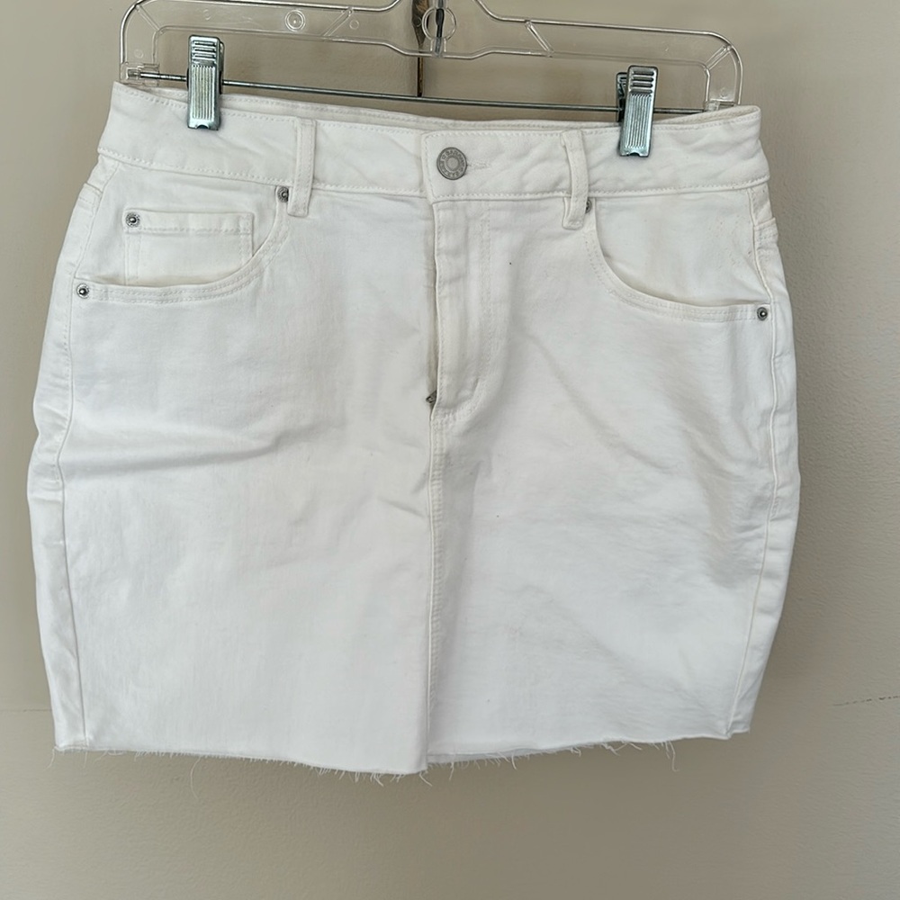 White denim mini skirt.